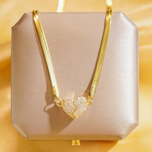 Luxury gold heart pendant necklace with full cubic zirconia stones on a sleek snake chain