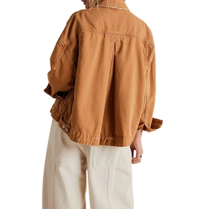 Back view of tan oversized denim jacket with drop shoulders and distressed hem detail