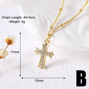 Close-up of gold cross necklace with inlaid diamonds and 44 plus 5 cm chain