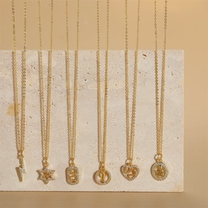 Star and snake charms on 14K gold plated necklaces with micro-inlaid zircon