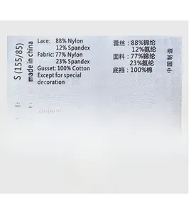 Detail of care label showing 100% cotton crotch and lace material for thong underwear