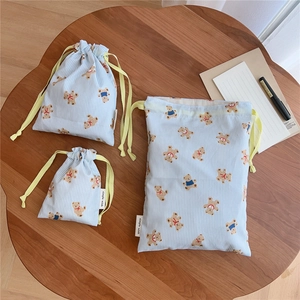 Three-piece set of blue striped cotton drawstring bags with cute bear prints in various sizes