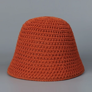 Detailed close-up of caramel knitted bucket hat showing breathable hollow weave texture