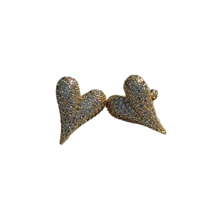 Sparkling heart stud earrings with pavé crystals in light gold finish on white background