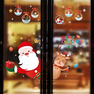 Detailed view of festive window stickers with Santa, reindeer and Merry Christmas text