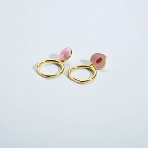 Close-up of S925 sterling silver peach earrings with pink enamel and gold hoop design