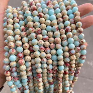 Macro shot of sky blue imperial stone beads with natural brown and red textures