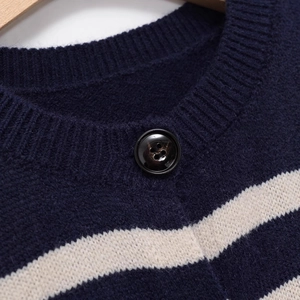 Striped knit cardigan with navy and beige bands featuring a glossy button and ribbed collar