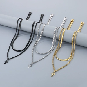 Detailed view of double-layer stainless steel Ankh cross necklaces in black, gold, and silver