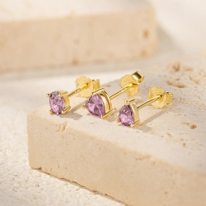Macro detail of S925 sterling silver studs set featuring pink zircon heart and oval shapes
