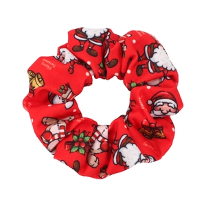 Detail of red Christmas scrunchie with Santa, reindeer and Merry Christmas print