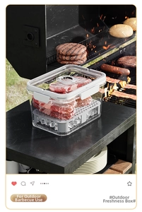 Macro view of portable food storage box with drainage tray for outdoor picnics and camping