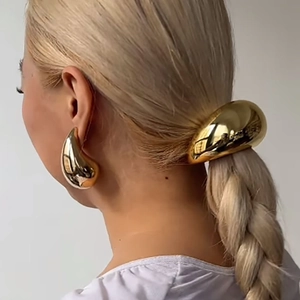 Minimalist gold teardrop earrings and sleek metal hair ring set for elegant ponytails