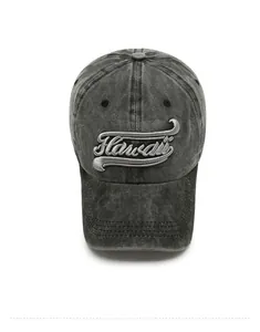 Macro view of dark grey washed denim baseball cap with Hawaii Aloha embroidery detail