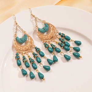 Bohemian crescent earrings with turquoise beads and gold ethnic filigree on silk