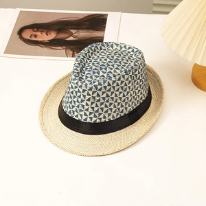 Summer paper straw jazz hat with geometric blue pattern and black ribbon band