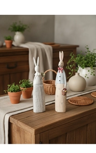 Detail of vintage resin rabbit figurines with faux wood texture in a rustic home setting