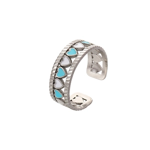 Adjustable silver heart ring with blue and white enamel inlay and textured edges