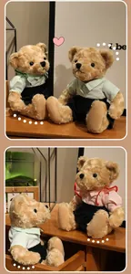 Detail of plush teddy bears in striped shirts and skirts on a warm wooden shelf