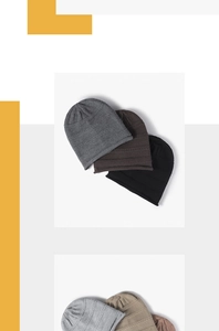 Close-up of assorted ribbed knit beanies in gray, khaki, and black autumn colors