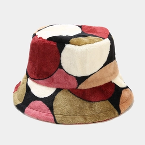 Detail of multi-color plush bucket hat with vibrant abstract polka dot faux fur texture