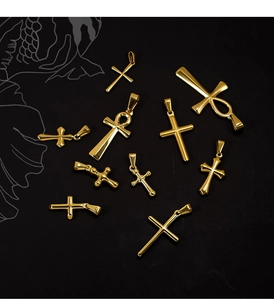 Collection of golden 24k plated stainless steel cross and ankh pendants on black background