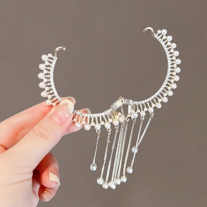 Detail view of elegant pearl tassel ear cuff with sparkling rhinestones and metal fringe