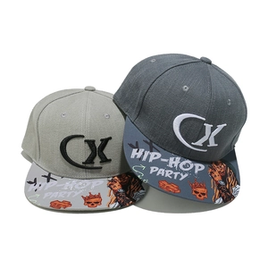 Detailed embroidery on a flat-brim snapback hat with street style graffiti brim patterns