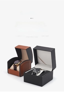 Detail view of premium PU leather watch boxes in brown and black with stitching and cushions