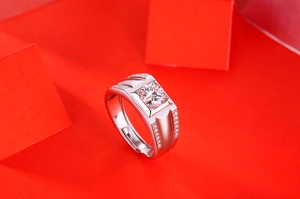 Macro detail of men's silver ring featuring square moissanite and adjustable band