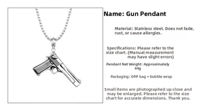 Detailed macro view showing the stainless steel pistol pendant and bead chain dimensions