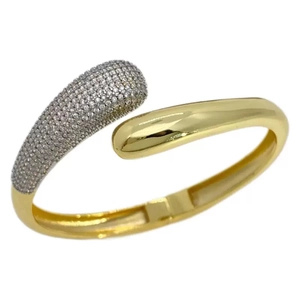 Golden teardrop open bangle featuring sparkling cubic zirconia pavé and polished finish