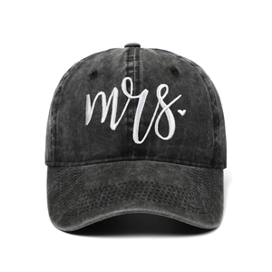 Close-up of white Mrs. embroidery and heart on washed black vintage cotton baseball cap