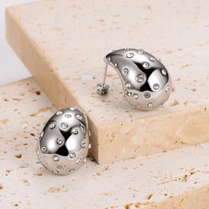 Silver teardrop earrings in stainless steel with sparkling rhinestones on beige stone