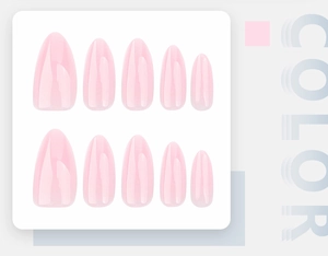 Detailed view of pale pink almond shaped press-on nails with a glossy polished finish