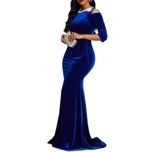 Close-up of royal blue velvet dress with white floral lace trim on the off-shoulder neckline