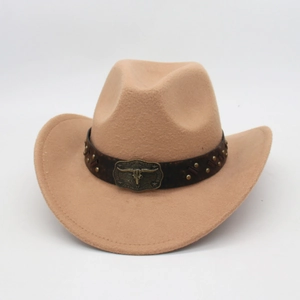 Detail of western cowboy hat featuring vintage bull head metal buckle and silver studs