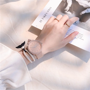 Close-up of minimalist pink macaron watch with matte dial and soft silicone strap