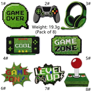 Detailed embroidery view of 8 green game-themed patches with high-quality stitching texture