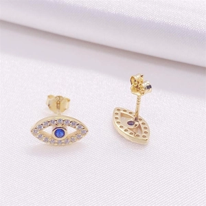 Detail of 925 sterling silver evil eye stud earrings with blue stones and white zircon
