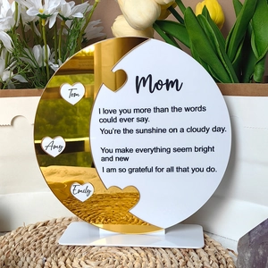 Detail of acrylic Mother's Day plaque with golden mirror finish and custom names