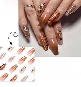 Macro shot of coffin press-on nails with maple leaf sequins and brown glitter gradient