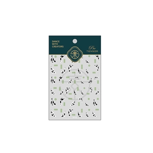 Minimalist green and cow print nail art stickers with geometric patterns on card