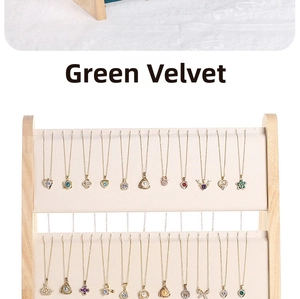 Macro detail of necklaces on a double-layer green velvet jewelry display stand