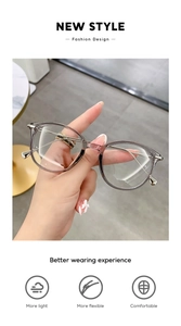 Detail of transparent gray cat-eye frames featuring flexible and lightweight metal temples