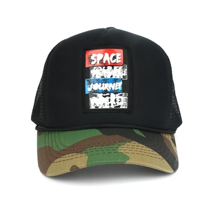 Black trucker hat with camouflage brim and space journey embroidery on white background