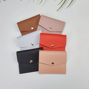 Flat lay showing slim credit card holders in six colors with pebble grain faux leather
