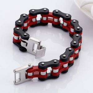 Detail of hip hop style bicycle chain bracelet in black red and silver stainless steel