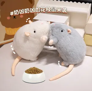 Detail of plush gray and white hamster toys with soft long fur and cute pink ears