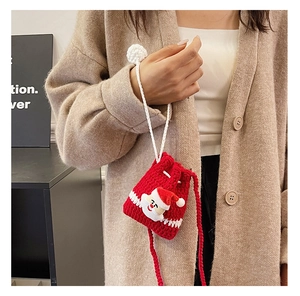 Red Christmas Santa Claus crochet crossbody bag shown being worn by a person